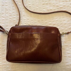 Clare V. Marisol in brown leather.